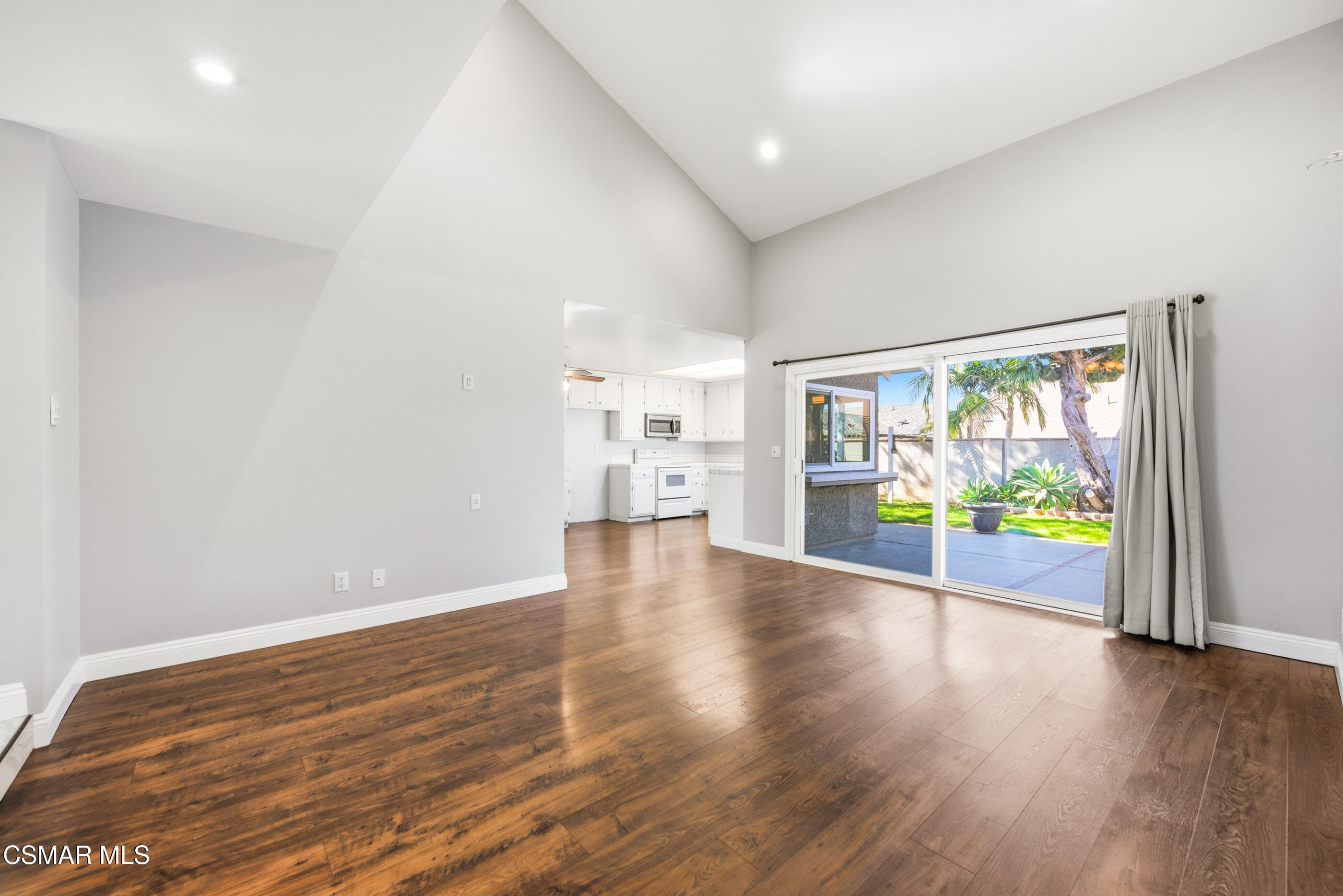 2249 St Clair Avenue Simi Valley, CA 93063 - Photo 17 of 60 a view of an empty room with wooden floor and a window