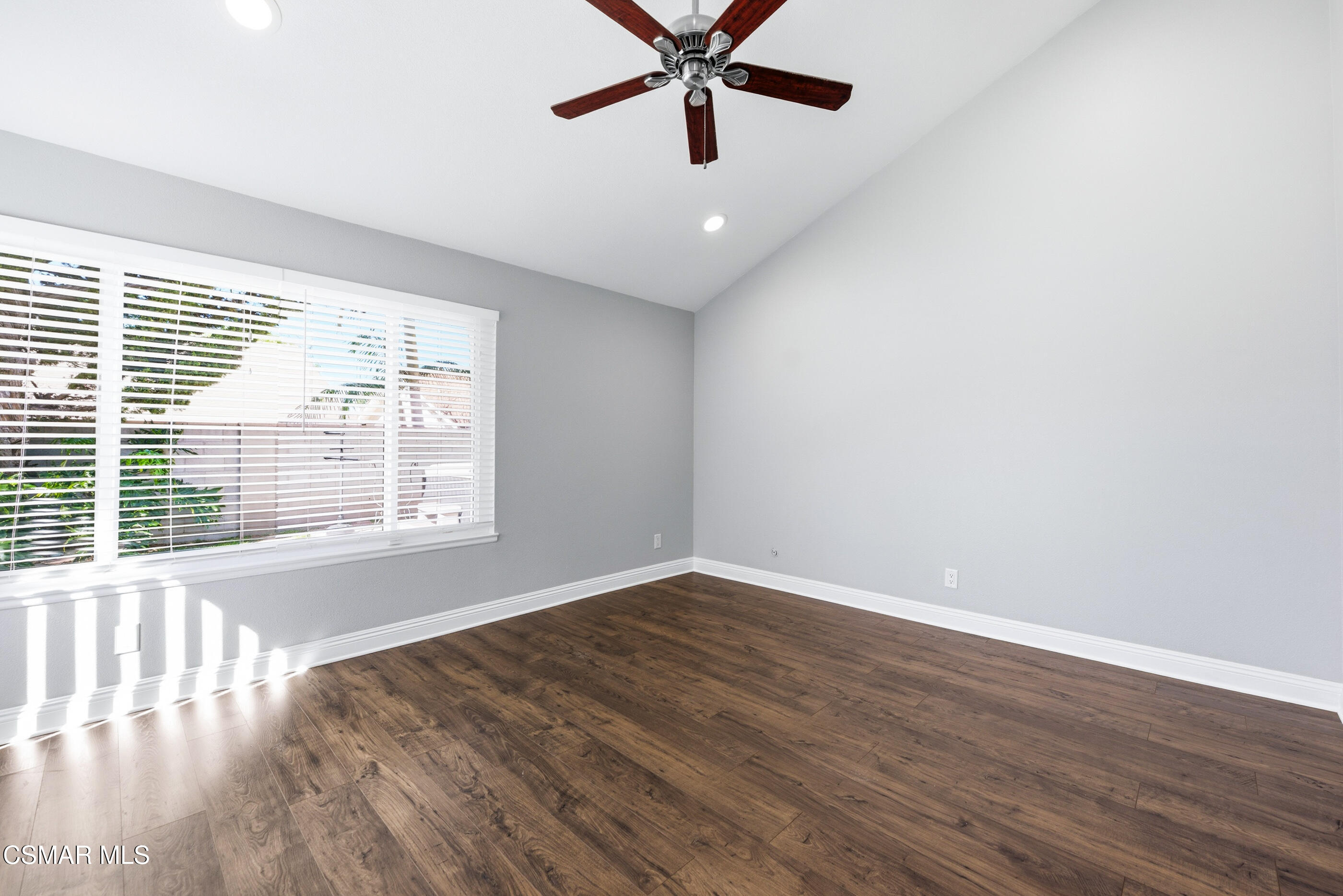 2249 St Clair Avenue Simi Valley, CA 93063 - Photo 32 of 60 a view of an empty room with wooden floor and a window