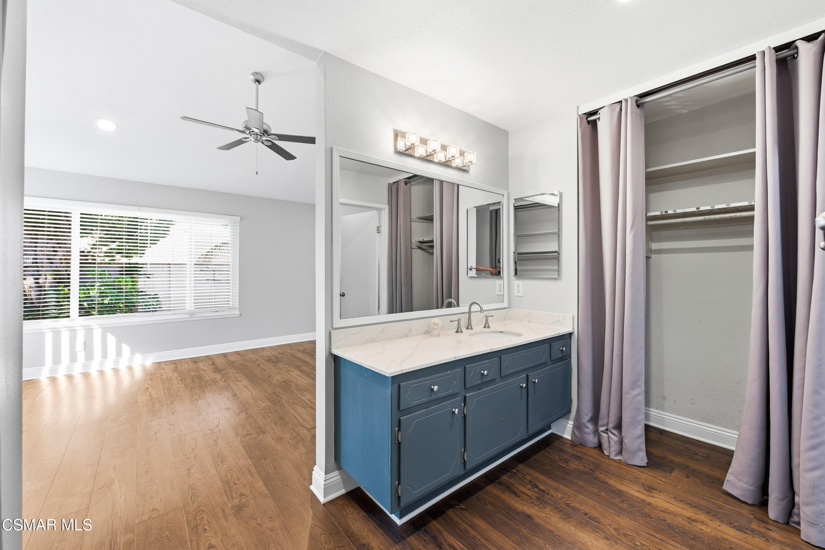 2249 St Clair Avenue Simi Valley, CA 93063 - Photo 33 of 60 a bathroom with a double vanity sink a mirror and a shower