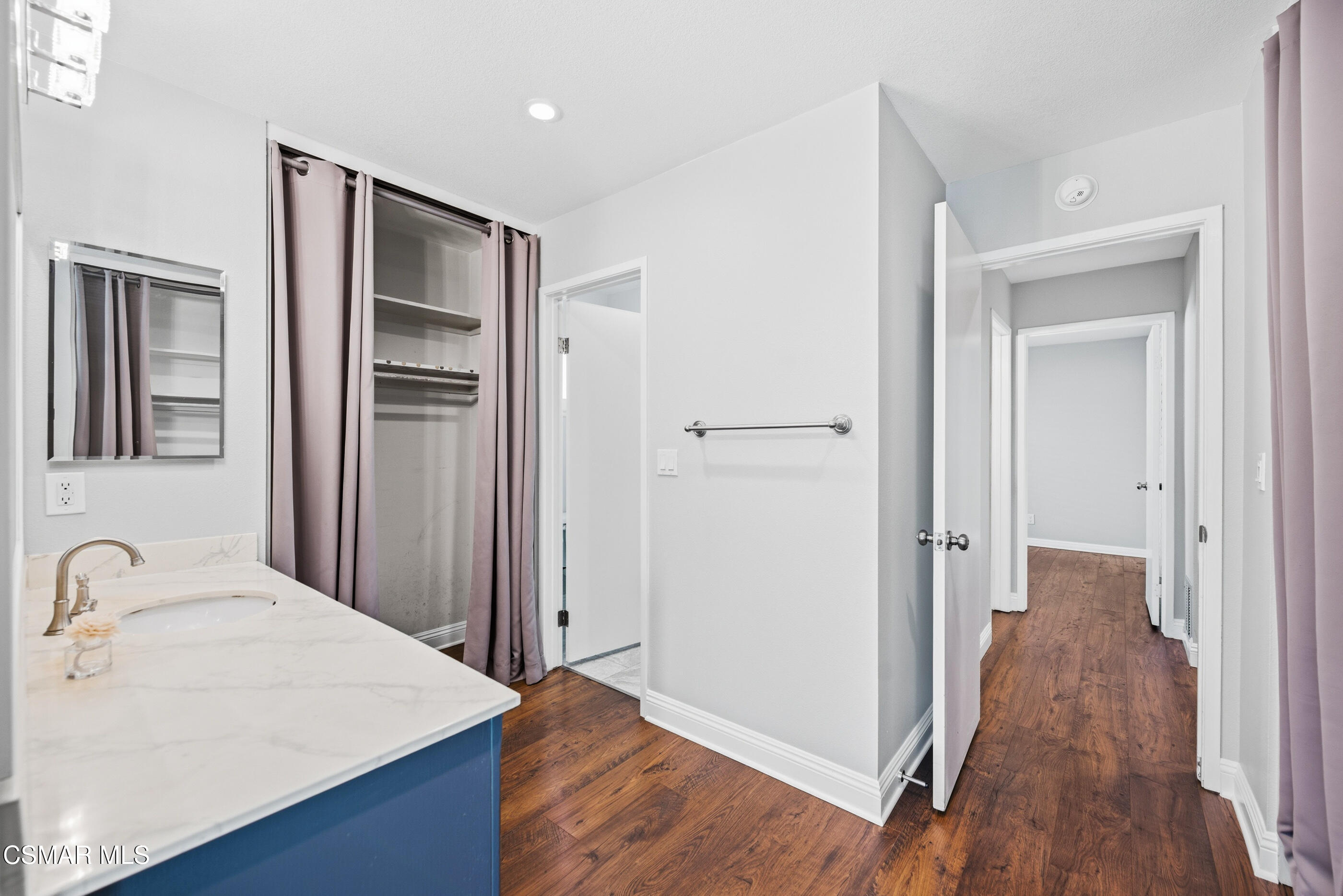 2249 St Clair Avenue Simi Valley, CA 93063 - Photo 34 of 60 a view of a hallway with wooden floor and cabinet