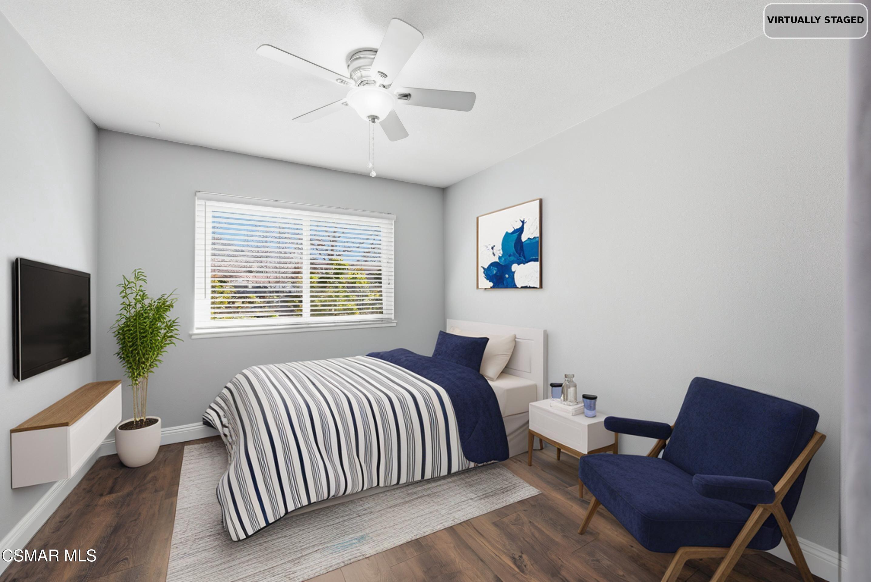 2249 St Clair Avenue Simi Valley, CA 93063 - Photo 36 of 60 a bedroom with a bed and a chandelier