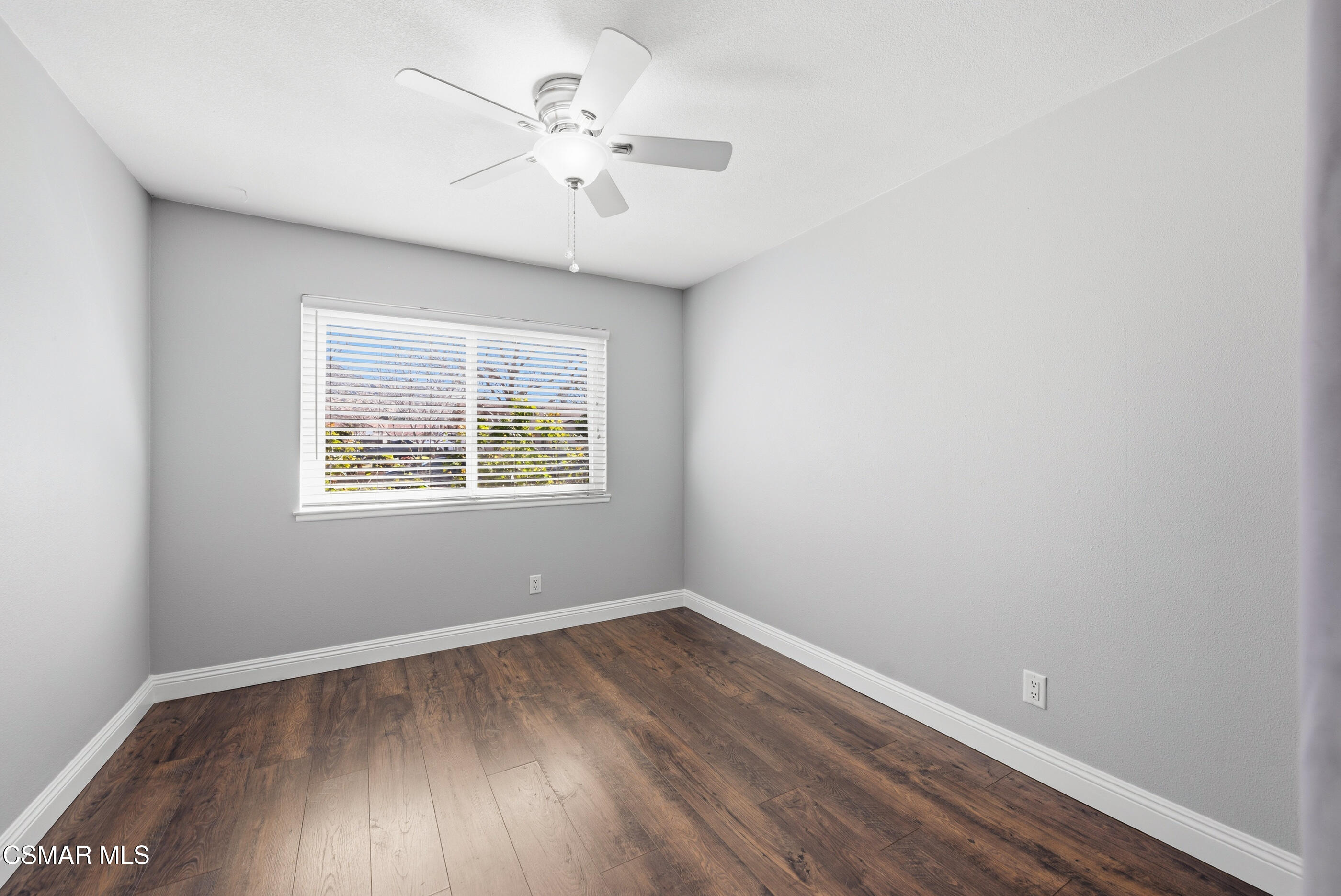 2249 St Clair Avenue Simi Valley, CA 93063 - Photo 37 of 60 an empty room with wooden floor and windows