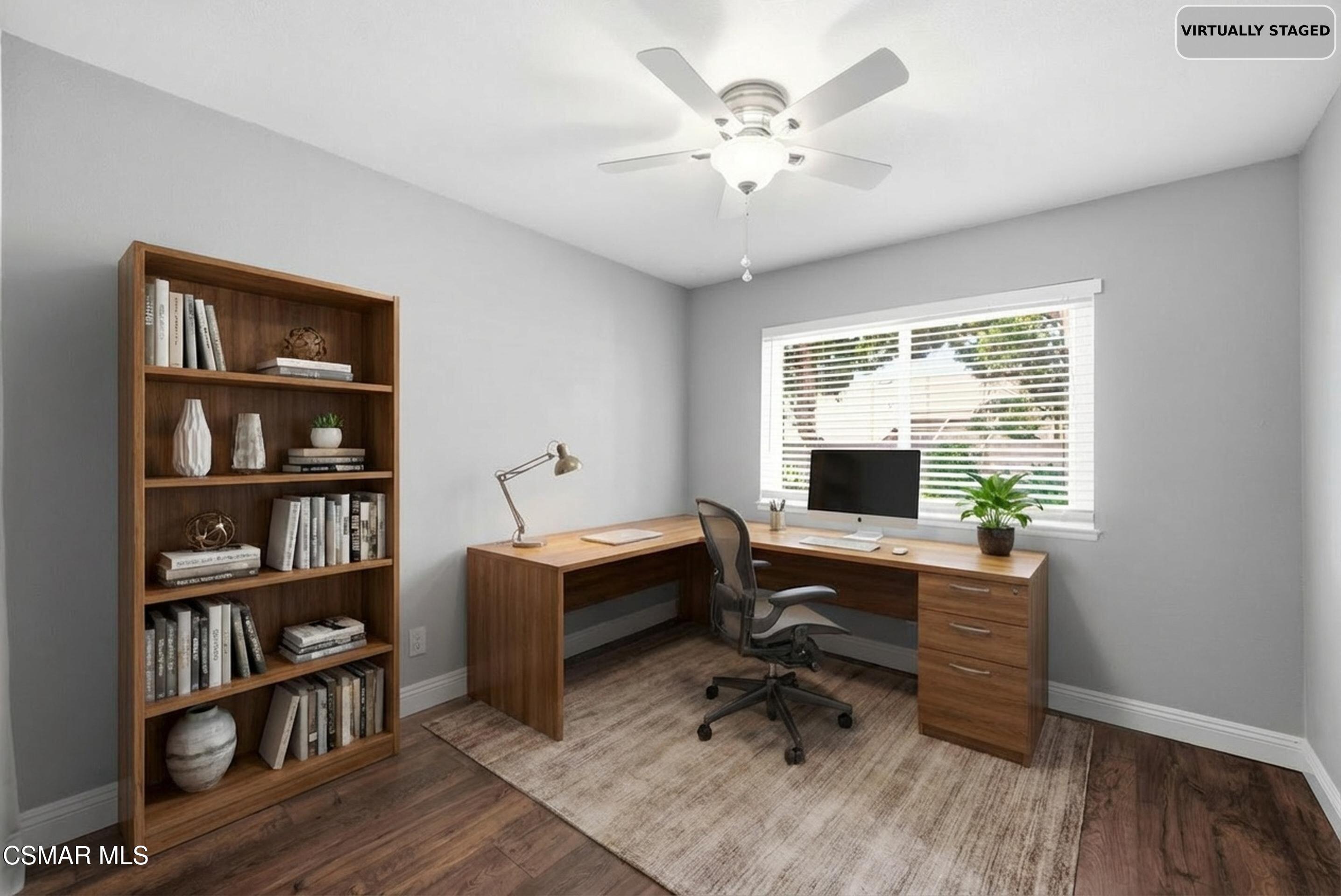 2249 St Clair Avenue Simi Valley, CA 93063 - Photo 40 of 60 a view of a workspace with furniture and a bookshelf