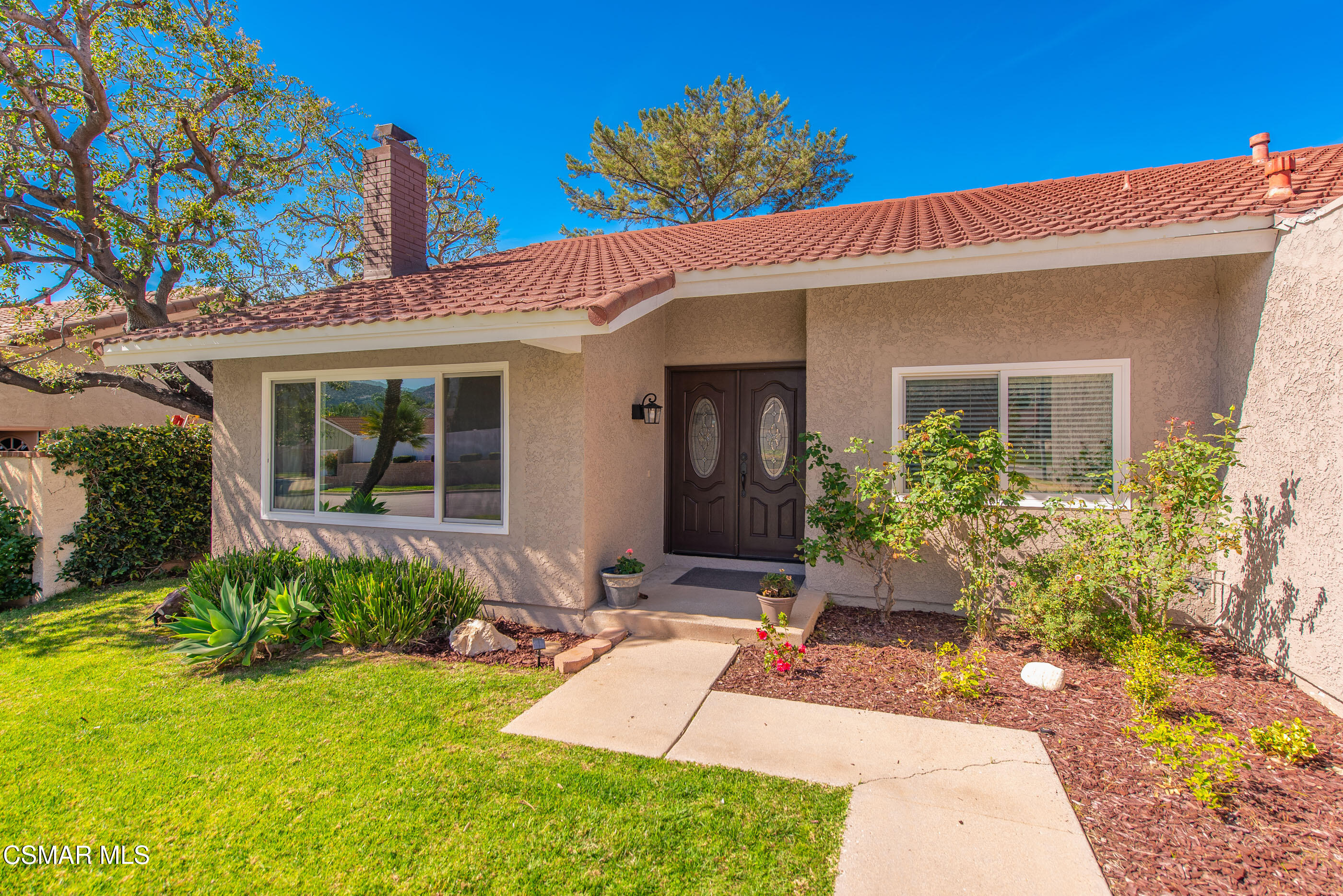 2249 St Clair Avenue Simi Valley, CA 93063 - Photo 5 of 60 a front view of a house with garden