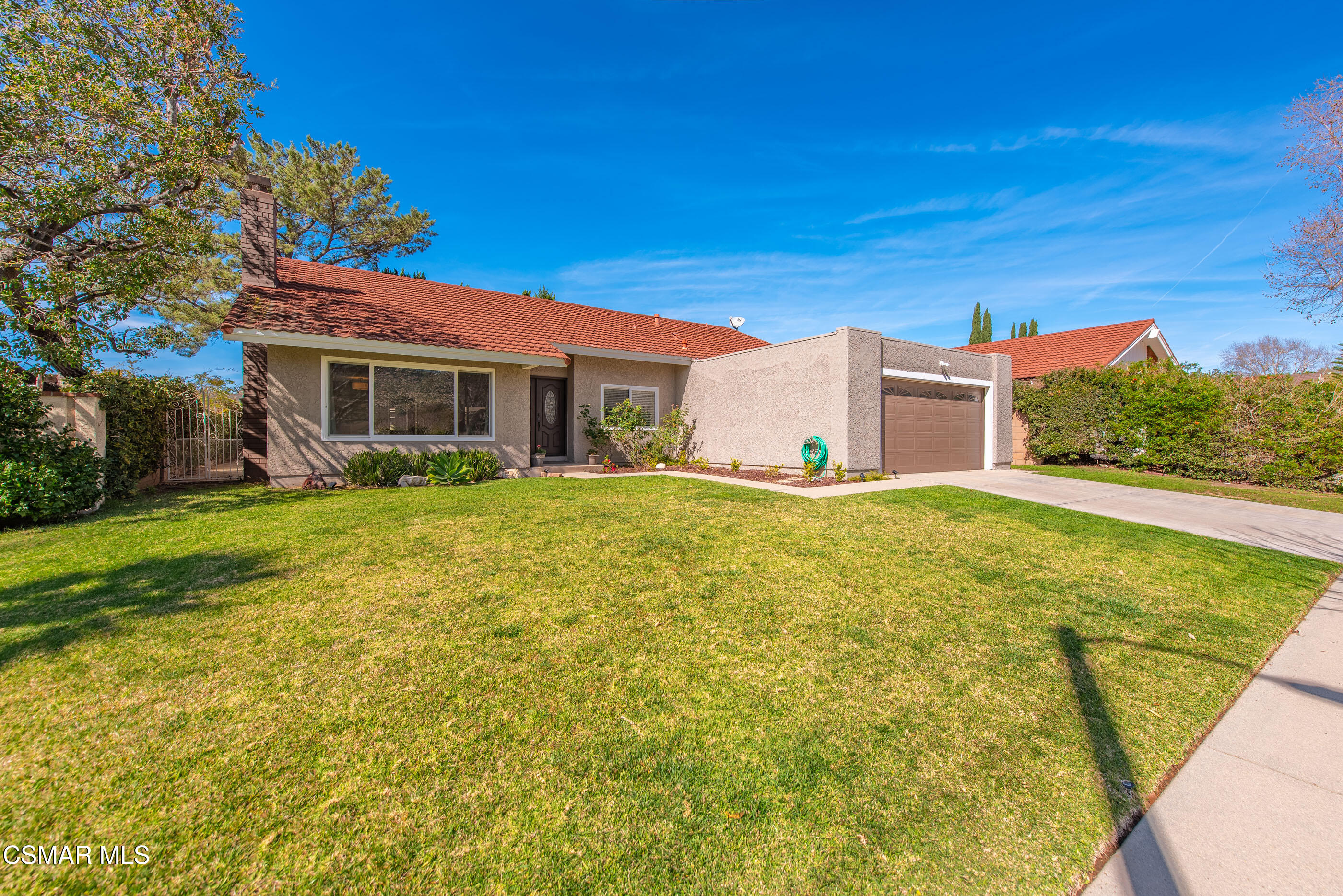 2249 St Clair Avenue Simi Valley, CA 93063 - Photo 58 of 60 a front view of house with yard and trees in the background