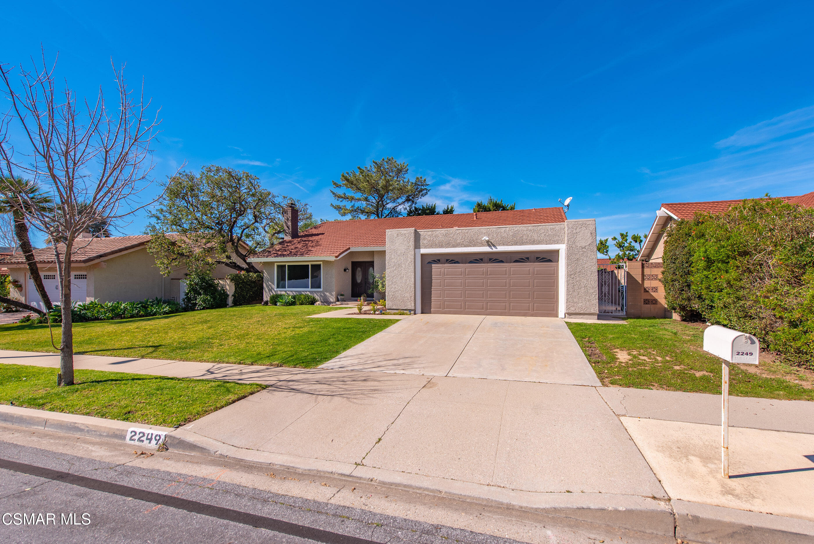 2249 St Clair Avenue Simi Valley, CA 93063 - Photo 60 of 60 a front view of a house with a yard and garage