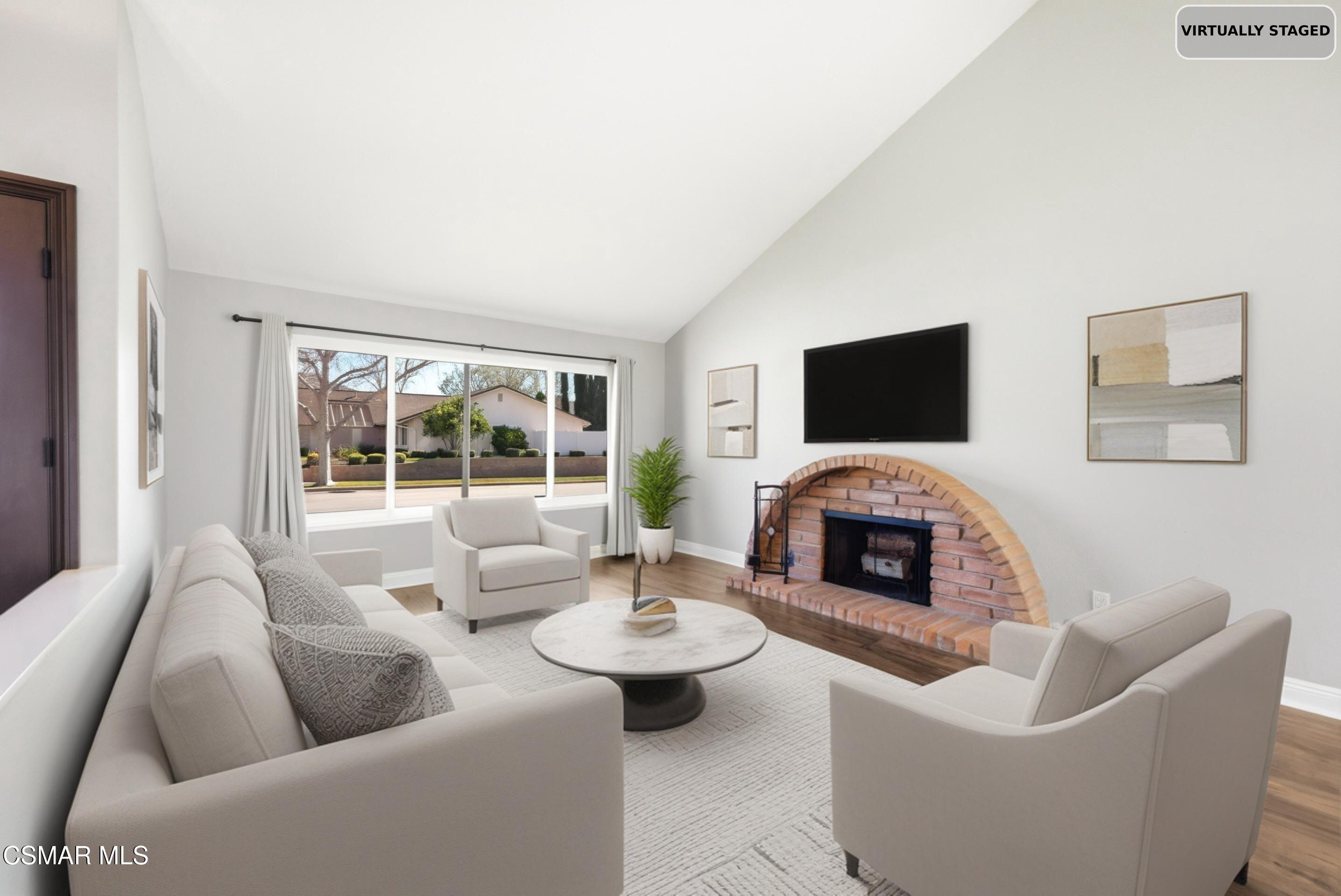 2249 St Clair Avenue Simi Valley, CA 93063 - Photo 8 of 60 a living room with furniture flat screen tv and a fireplace
