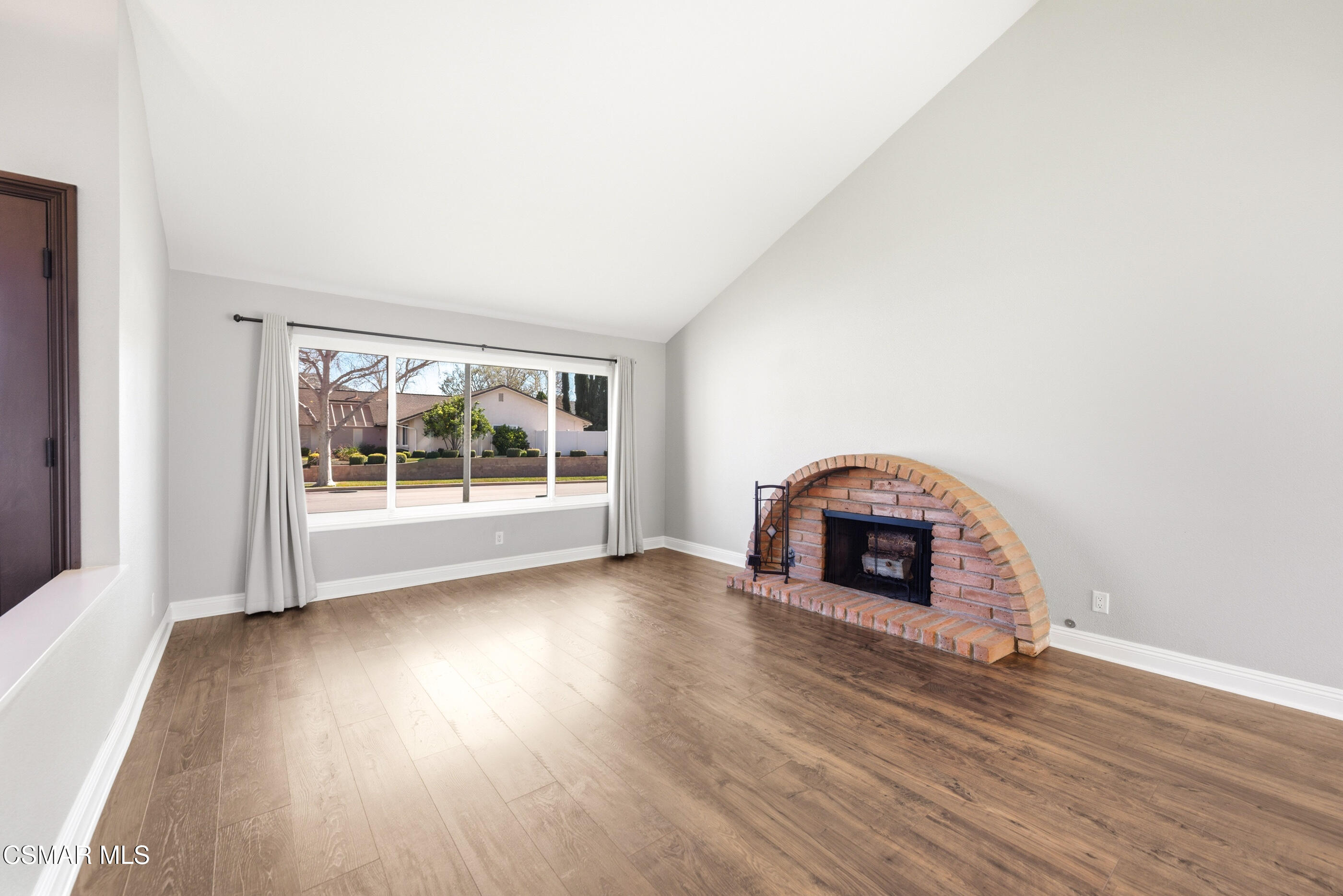 2249 St Clair Avenue Simi Valley, CA 93063 - Photo 9 of 60 an empty room with floor to ceiling window and fireplace