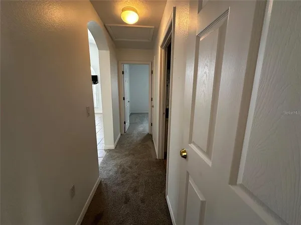 a view of a bathroom from a hallway