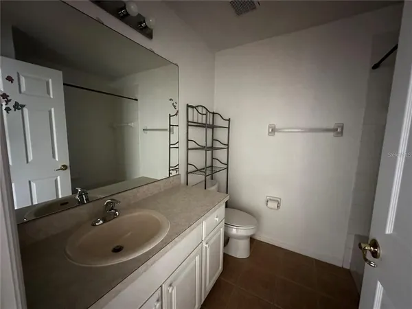 a bathroom with a sink and toilet