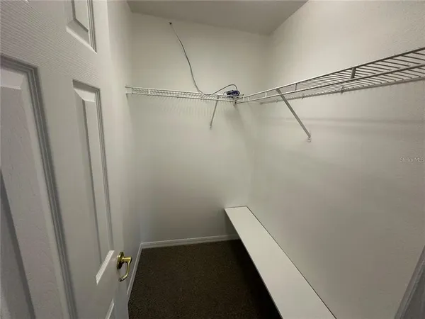 a view of a room with racks on the wall