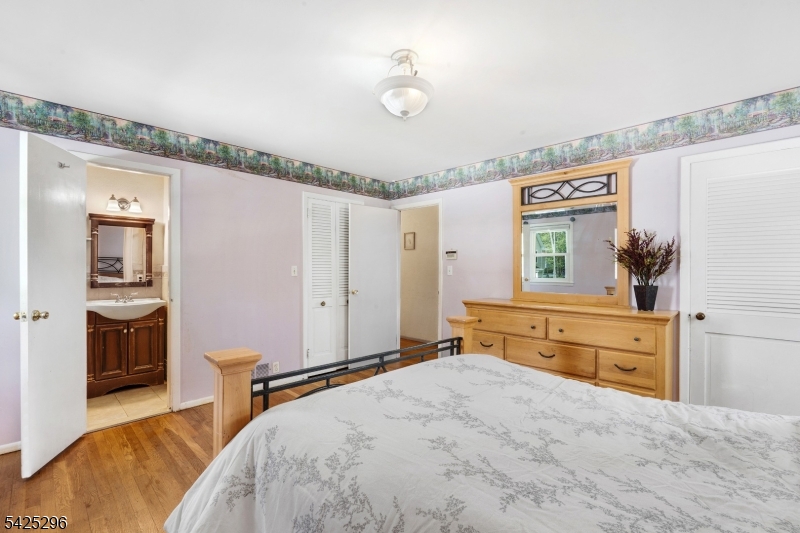 156 Wentz Avenue Springfield, NJ 07081 - Photo 13 of 27 a bedroom with a bed and a dresser