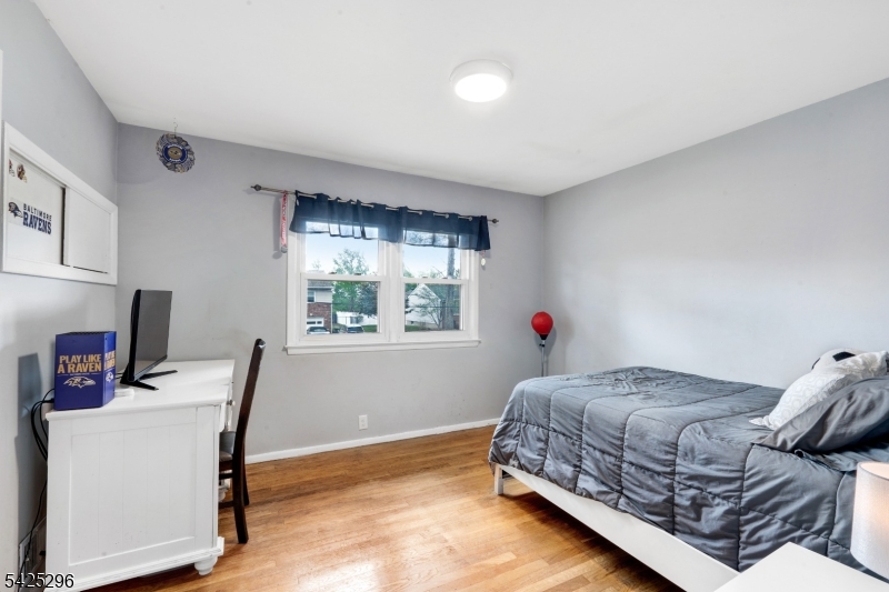 156 Wentz Avenue Springfield, NJ 07081 - Photo 15 of 27 a bedroom with a bed and a window