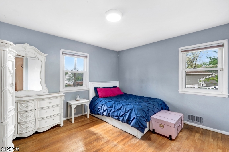 156 Wentz Avenue Springfield, NJ 07081 - Photo 16 of 27 a living room with furniture and a dresser