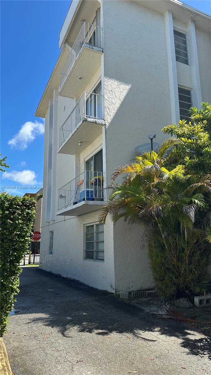 2138 Southwest 6th Street, Unit 102 Miami, FL 33135 - Photo 11 of 11 a front view of a house with a yard