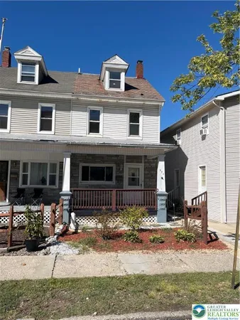 a front view of a house with a porch