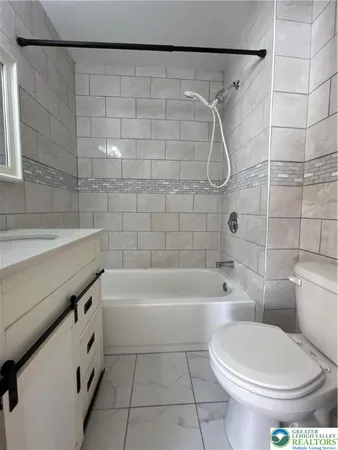 a view of a swimming pool with a chair