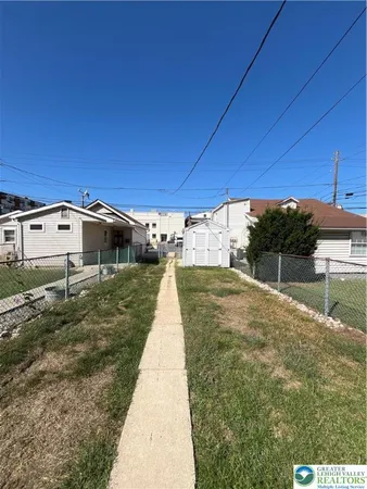 a view of a livingroom with furniture and staircase