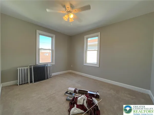 a view of livingroom with furniture and windows