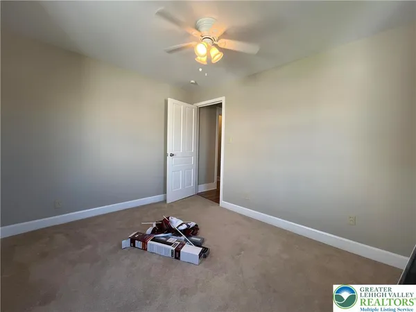 a room with toys and chandelier fan