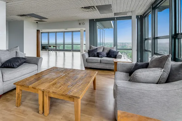 a living room with furniture and a large window