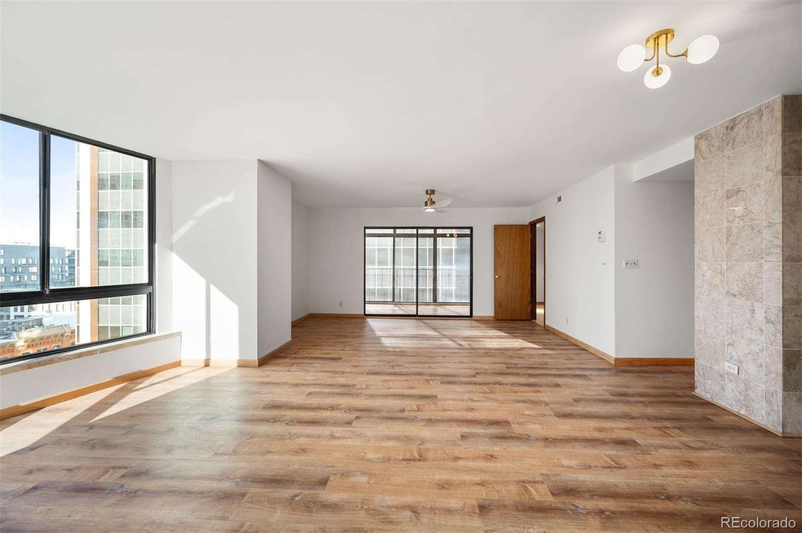 1777 Larimer Street, Unit 1010 Denver, CO 80202 - Photo 12 of 48 a view of an empty room with a window