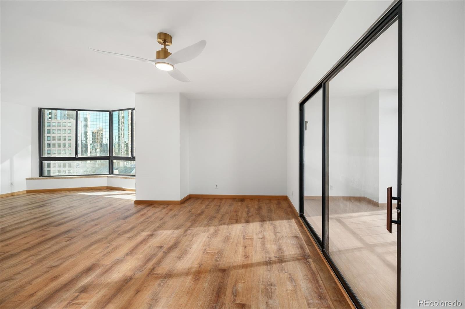 1777 Larimer Street, Unit 1010 Denver, CO 80202 - Photo 14 of 48 a view of an empty room and window