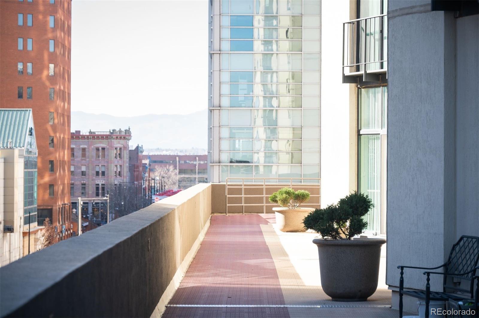 1777 Larimer Street, Unit 1010 Denver, CO 80202 - Photo 38 of 48 a view of a balcony with a potted plant