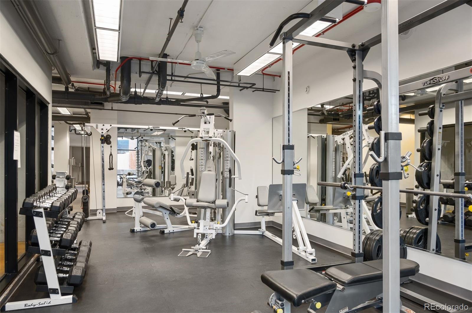 1777 Larimer Street, Unit 1010 Denver, CO 80202 - Photo 4 of 48 a view of a room with gym equipment