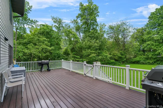 a view of balcony with deck and wooden floor