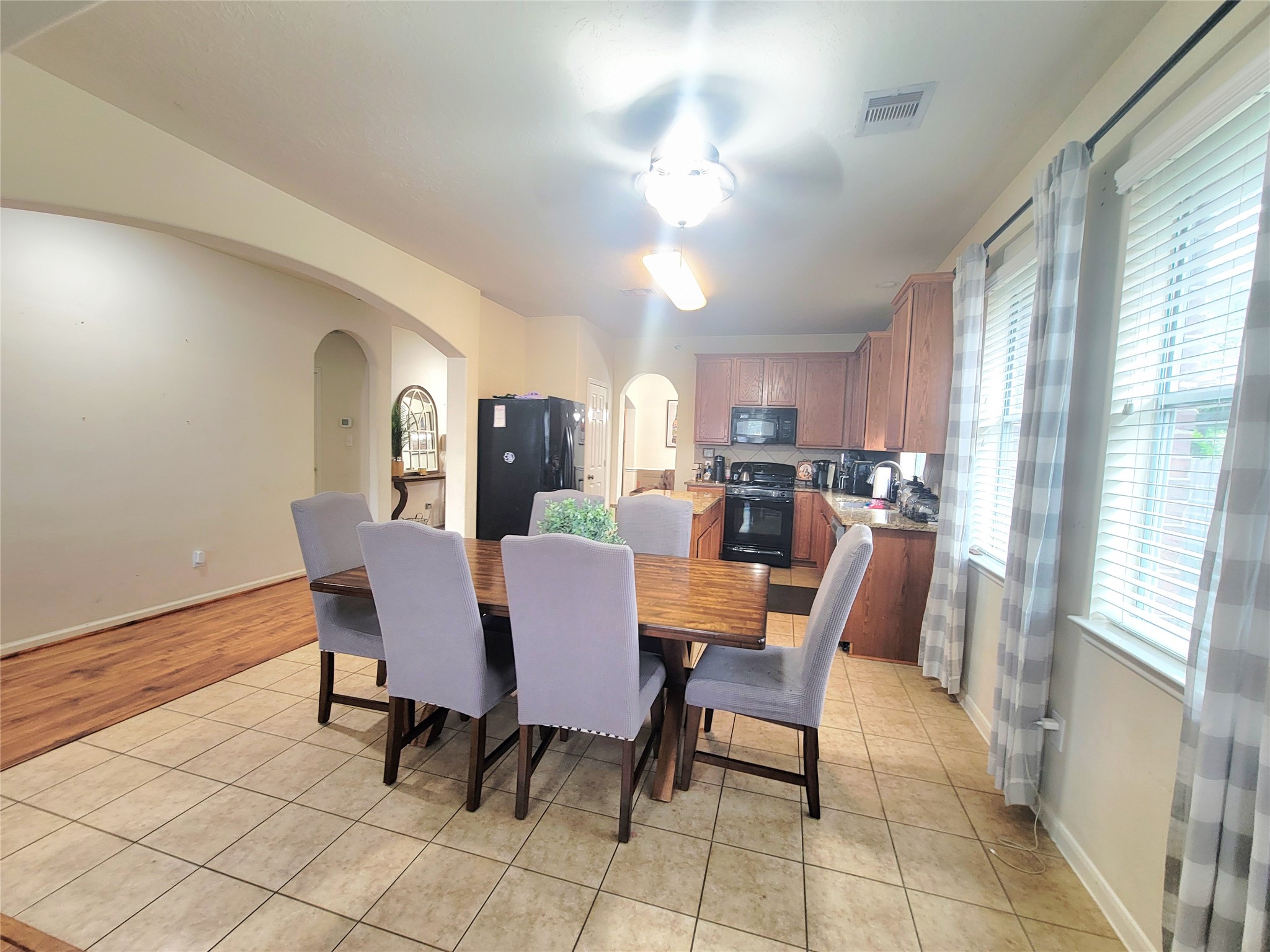 8811 Henrico Lane Rosenberg, TX 77469 - Photo 5 of 18 a view of a dining room with furniture and a chandelier
