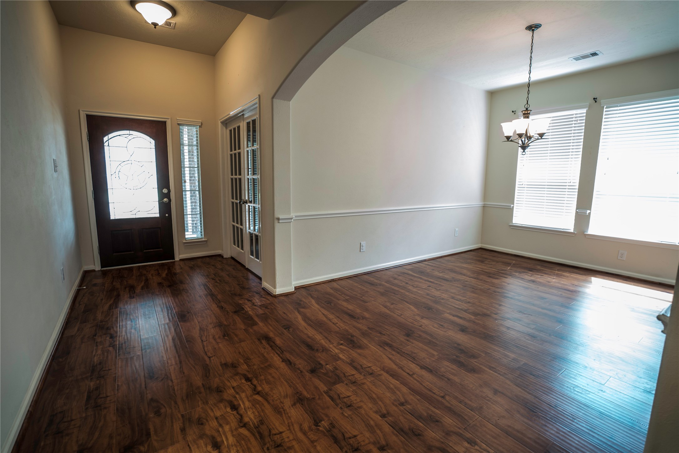 8811 Henrico Lane Rosenberg, TX 77469 - Photo 8 of 18 wooden floor in an empty room with a window