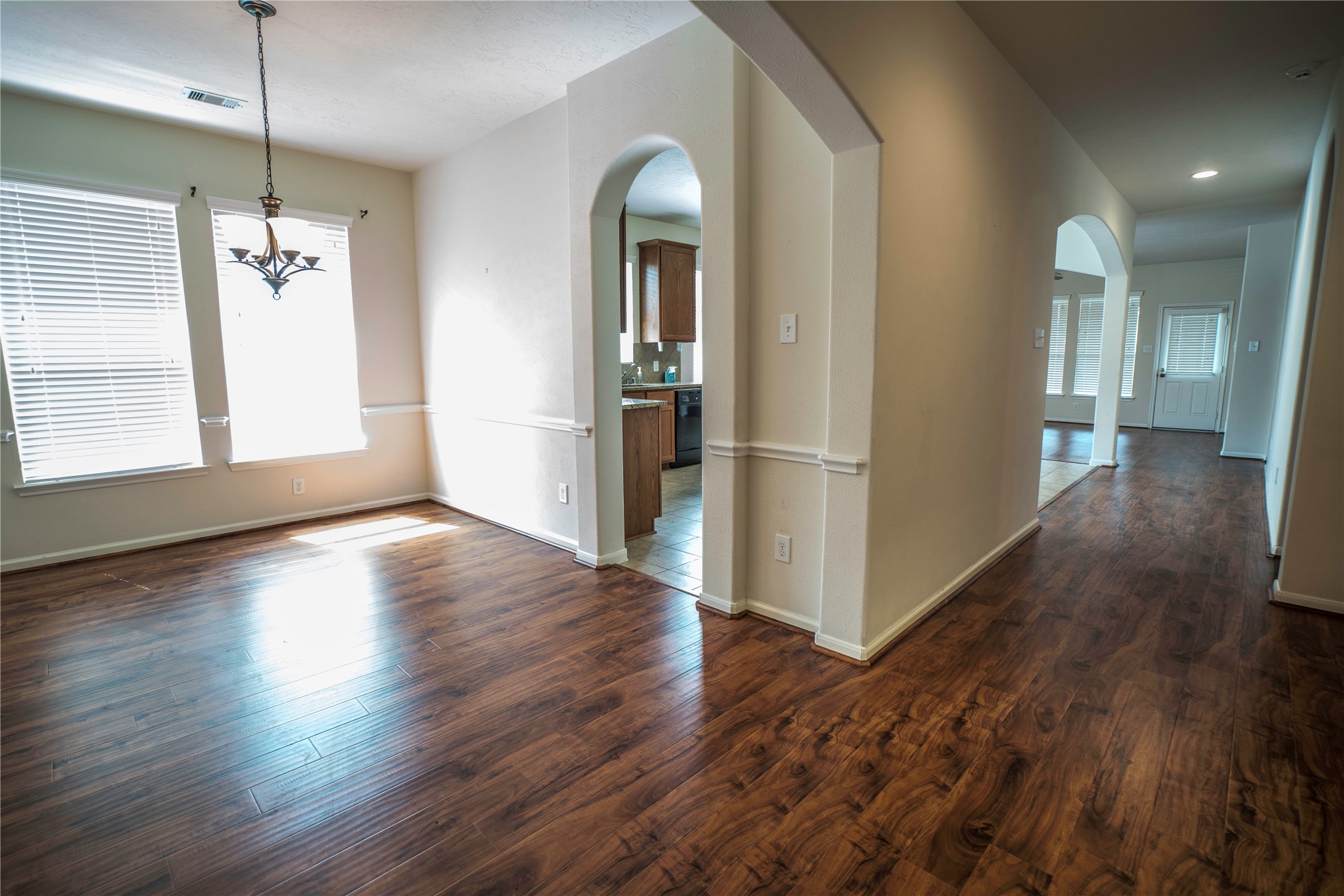 8811 Henrico Lane Rosenberg, TX 77469 - Photo 9 of 18 a view of a room with wooden floor lounge chair and windows