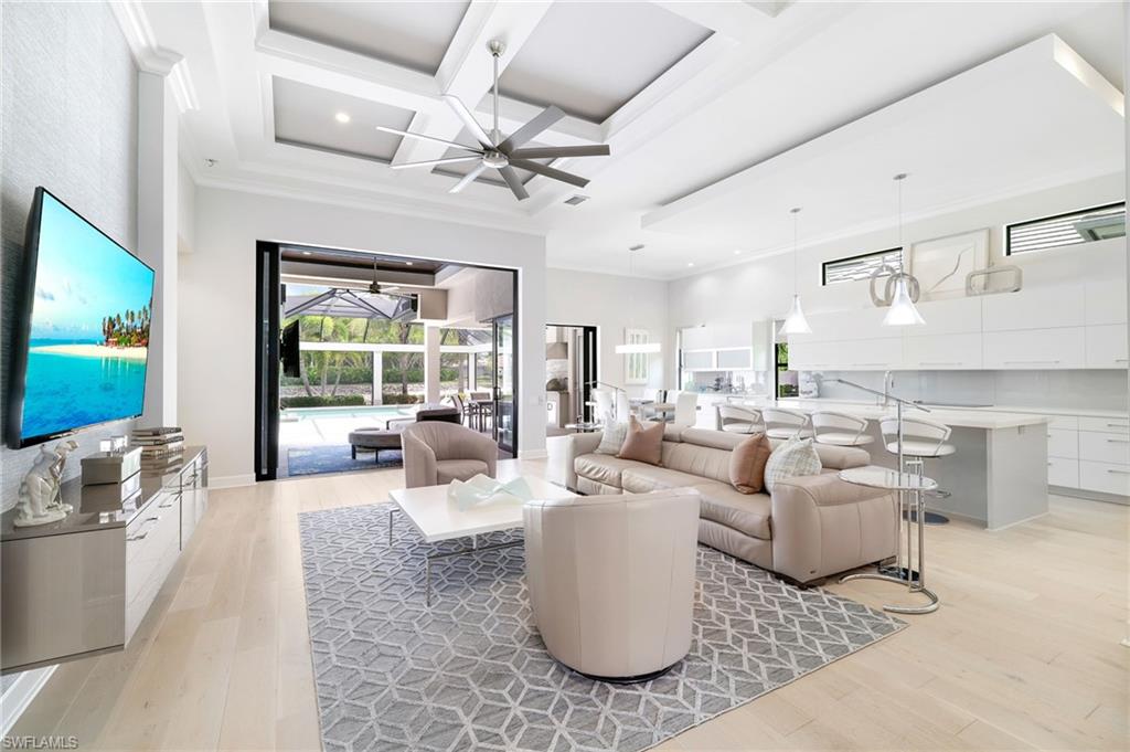 17441 Via Lugano Court Miromar Lakes, FL 33913 - Photo 1 of 40 a living room with patio furniture and a flat screen tv