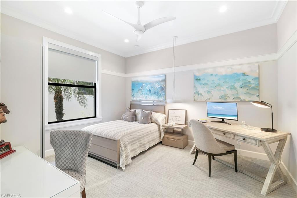 17441 Via Lugano Court Miromar Lakes, FL 33913 - Photo 19 of 40 a bedroom with a large bed and a window