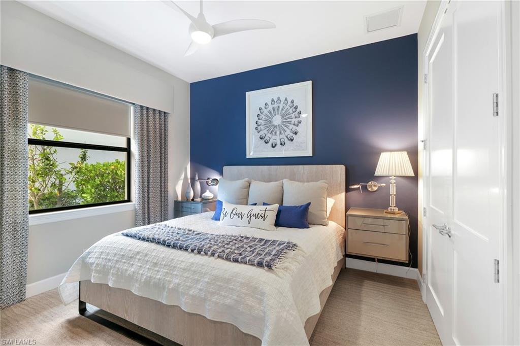 17441 Via Lugano Court Miromar Lakes, FL 33913 - Photo 20 of 40 a bedroom with a bed and a window