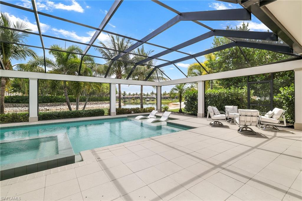 17441 Via Lugano Court Miromar Lakes, FL 33913 - Photo 2 of 40 a view of a swimming pool with a patio