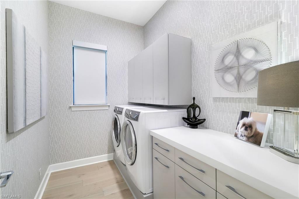 17441 Via Lugano Court Miromar Lakes, FL 33913 - Photo 25 of 40 a view of a storage and utility room with a window