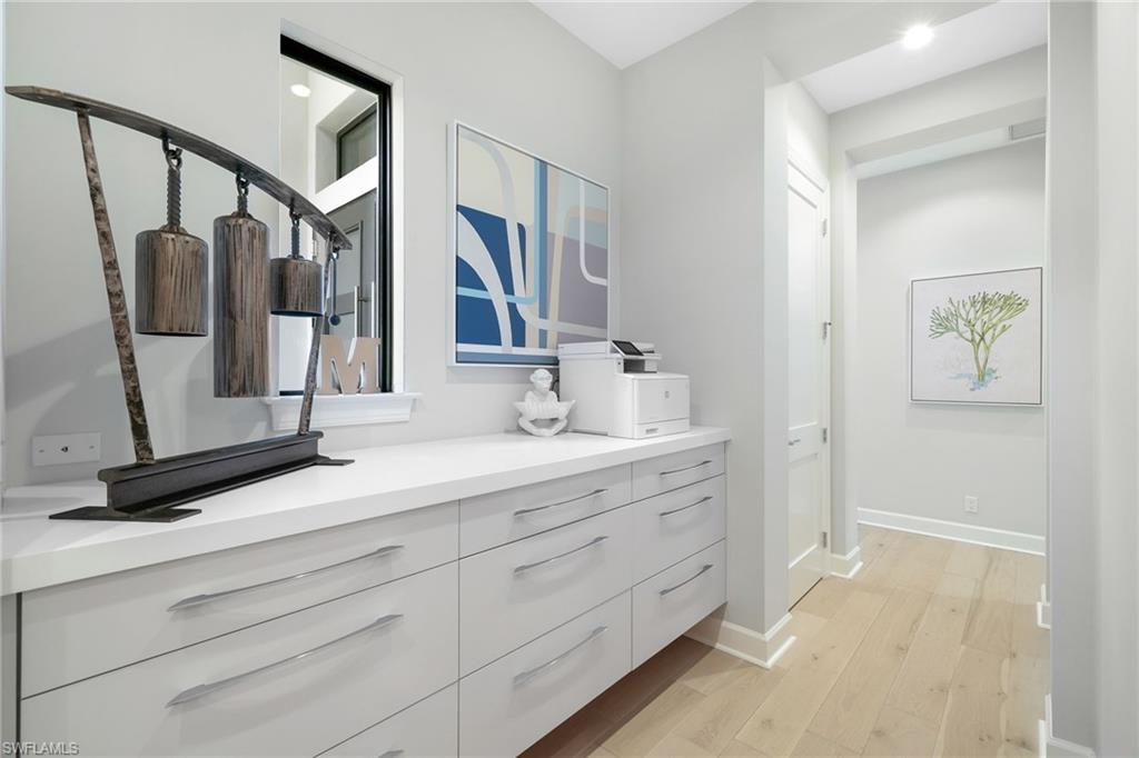 17441 Via Lugano Court Miromar Lakes, FL 33913 - Photo 26 of 40 a bathroom with a double vanity sink and a mirror