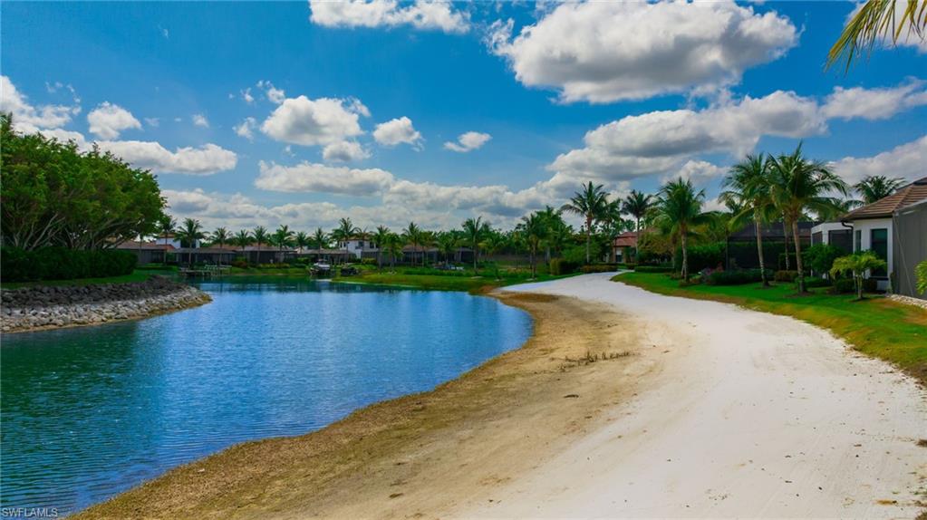 17441 Via Lugano Court Miromar Lakes, FL 33913 - Photo 32 of 40 a view of a lake with a big yard