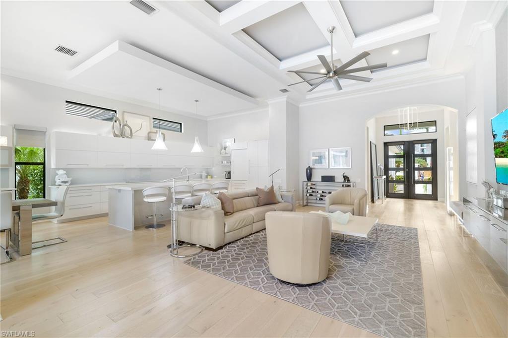 17441 Via Lugano Court Miromar Lakes, FL 33913 - Photo 7 of 40 a living room with furniture and a wooden floor
