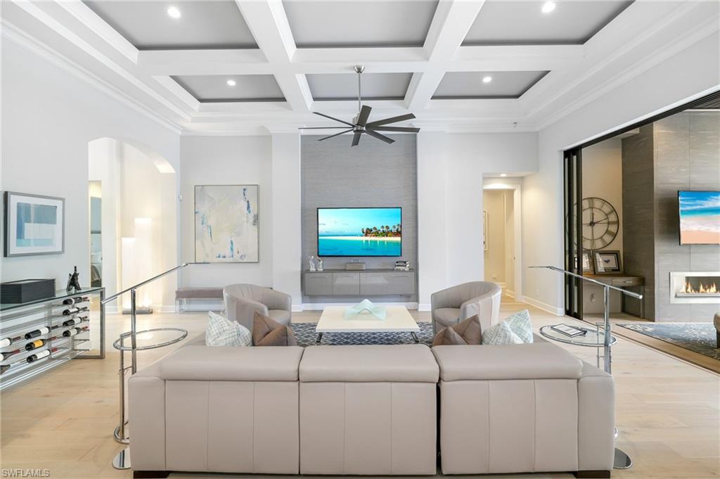 17441 Via Lugano Court Miromar Lakes, FL 33913 - Photo 9 of 40 a living room with furniture and a flat screen tv