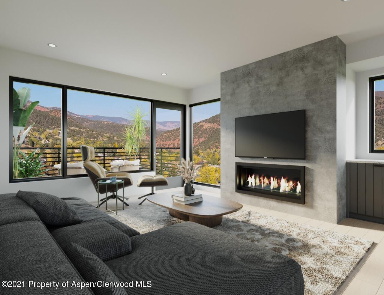 Two 2 Rivers Road, Unit PARK PLACE PHASE I Basalt, CO 81621 - Photo 4 of 10 a living room with furniture tv and a floor to ceiling window