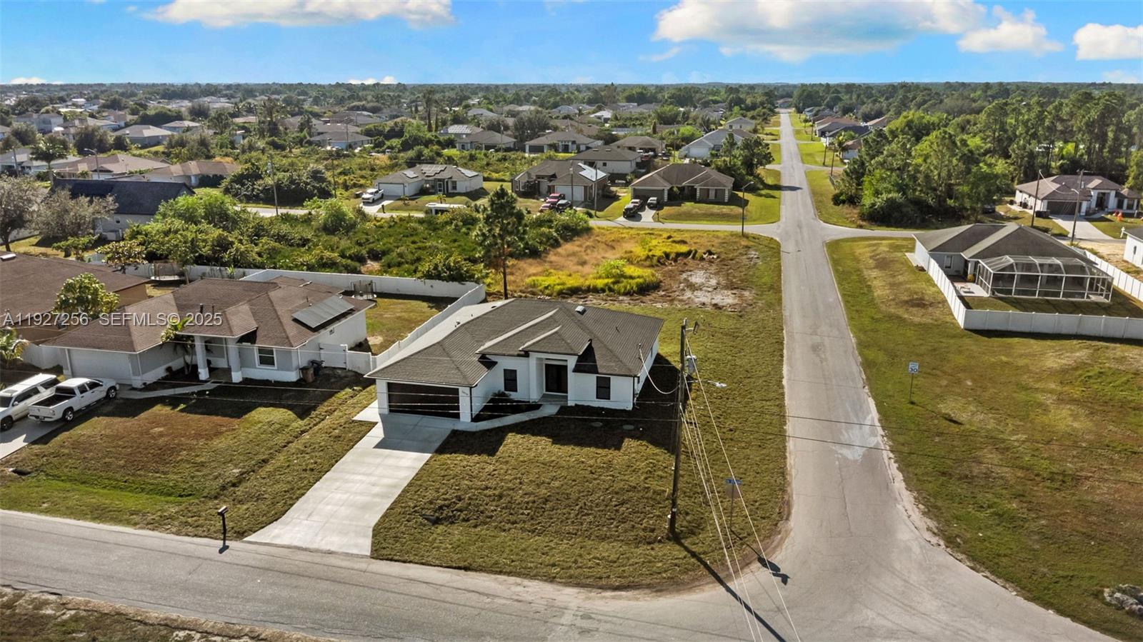 3419 16th Street Southwest Lehigh Acres, FL 33976 - Photo 35 of 46 an aerial view of a house with a ocean view