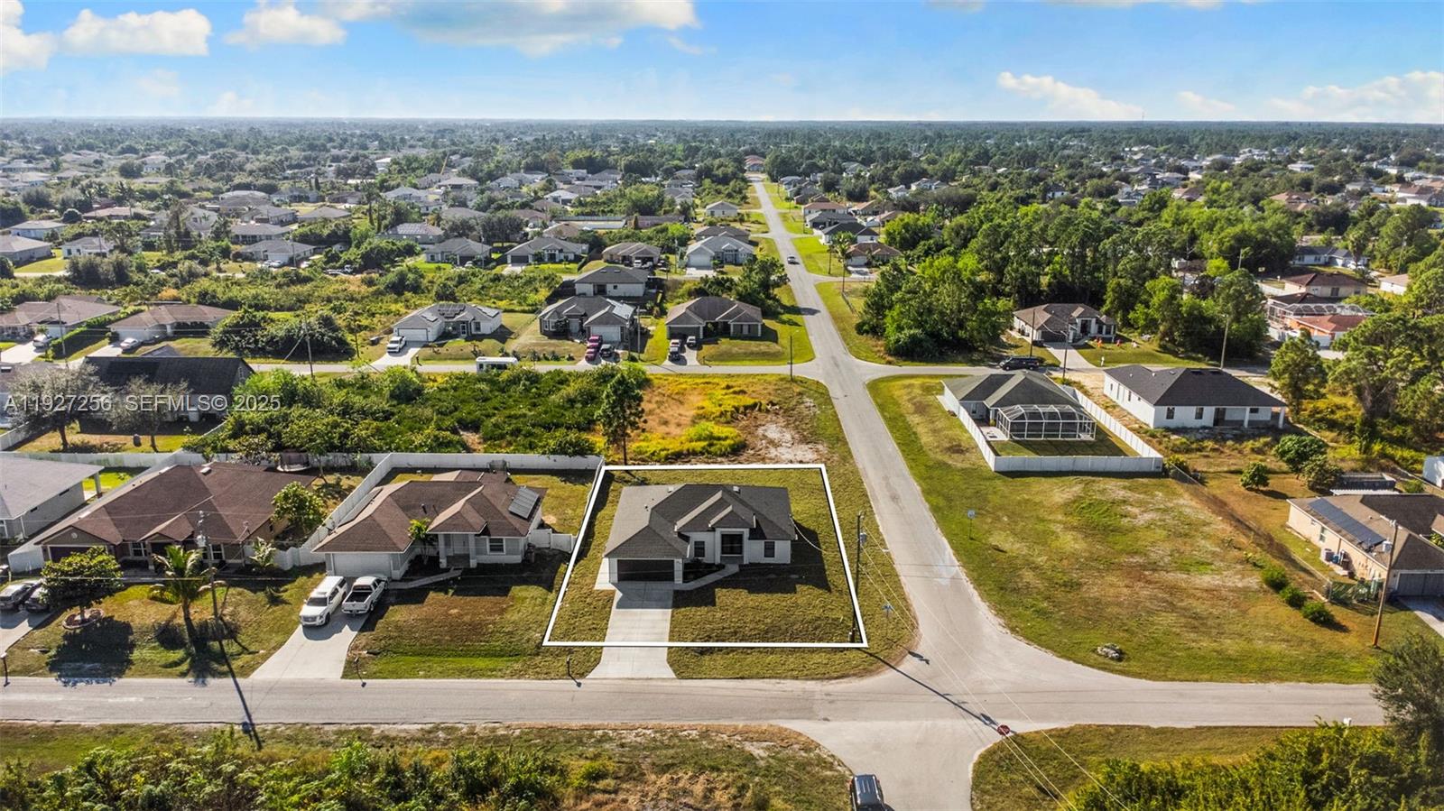 3419 16th Street Southwest Lehigh Acres, FL 33976 - Photo 43 of 46 an aerial view of a swimming pool