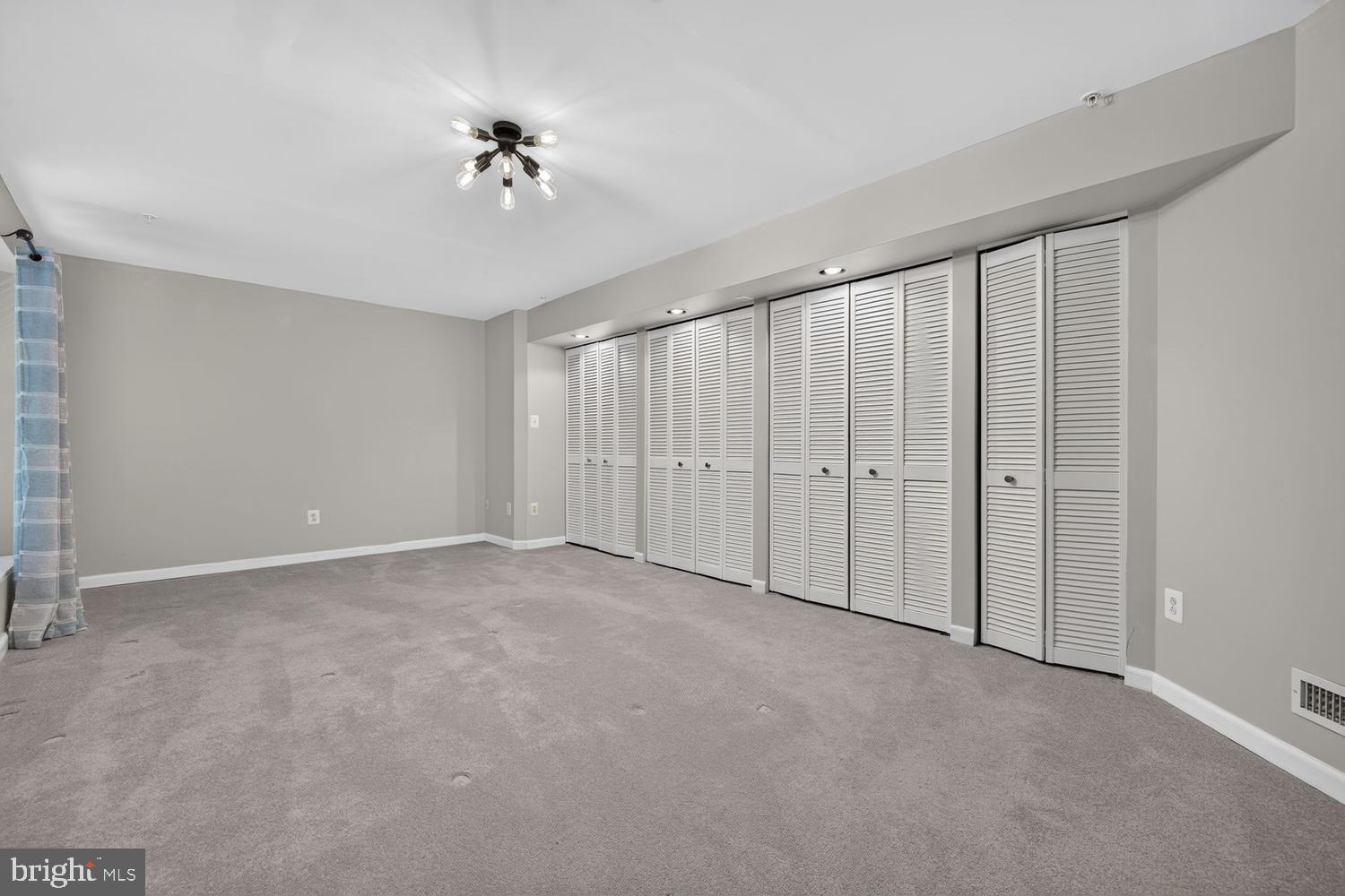 23106 Birch Mead Road Clarksburg, MD 20871 - Photo 36 of 60 a view of an empty room with a ceiling fan