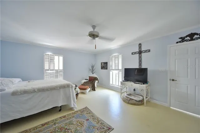 a living room with furniture a rug and a chandelier