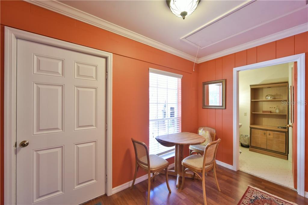 5208 Northeast 24th Street Ocala, FL 34470 - Photo 15 of 31 a view of a dining room with furniture and wooden floor