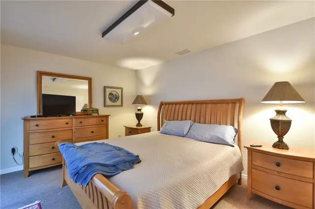 a living room with furniture and a lamp