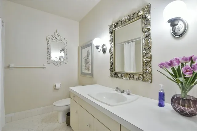 a large kitchen with a stainless steel appliances cabinets